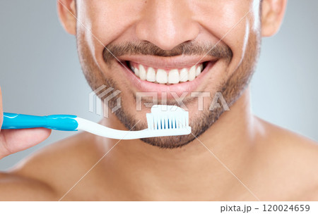 Smile, oral hygiene and toothbrush for man, mouth and studio for dental healthcare on white background. Grooming, closeup or routine with face for person, beauty or toothpaste for fresh breath health Smile, oral hygiene and toothbrush for man, mouth and studio for dental healthcare on white background. Grooming, closeup or routine with face for person, beauty or toothpaste for fresh breath health 120024659