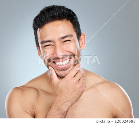 Beauty, grooming and smile with portrait of man in studio on gray background for cosmetic wellness. Dermatology, masculine and skincare with face of happy person in bathroom for hydration or hygiene 120024693