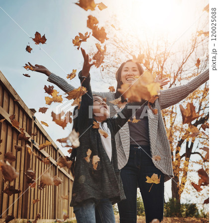 Asian, woman and child in outdoor, park or garden with enjoying autumn, playing and fun for bonding. Female person, girl and together as mother and daughter family on weekend, break or relax in Japan 120025088