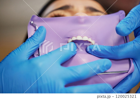 Dentist, dental and rubber dam for toothache in clinic, health and treatment for cleaning mouth. Teeth whitening, smile and person with torque wrench machine, orthodontics and oral care for veneers Dentist, dental and rubber dam for toothache in clinic, health and treatment for cleaning mouth. Teeth whitening, smile and person with torque wrench machine, orthodontics and oral care for veneers 120025321