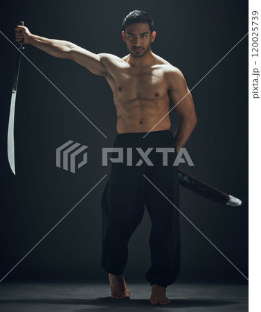 Portrait, samurai sword and Asian man in studio for training, exercise and wellness with martial arts. Blade, discipline and ninja or warrior by black background for karate and battle in Japan Portrait, samurai sword and Asian man in studio for training, exercise and wellness with martial arts. Blade, discipline and ninja or warrior by black background for karate and battle in Japan 120025739