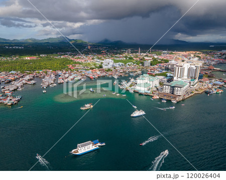 Aerial drone view of commercial pier and fisherman village at Semporna, Malaysia 120026404