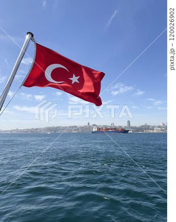 Turkish flag waves over Bosphorus sea and cityscape of Istanbul in Turkey Turkish flag waves over Bosphorus sea and cityscape of Istanbul in Turkey 120026902
