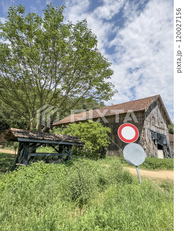 blank or empty mockup road signs by wooden hut house 120027156