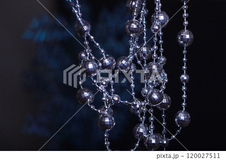 Crystal beads hanging disco garland shining on dark background. Christmas, New Year 2025 120027511