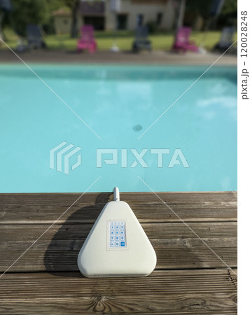 robotic vacuum cleaner of swimming pool at garden in sunny day	robotic vacuum cleaner of swimming pool at garden in sunny day 120028248