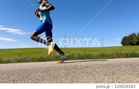 male rwandan runner running marathon in Italy 120028383