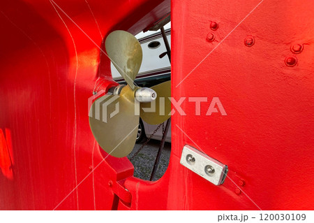 Propeller ship in dry dock. The vessel stands showcasing its structure and intricate details 120030109