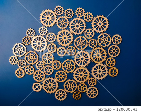Top view wooden gear on a blue background. Top view wooden gear on a blue background. 120030543