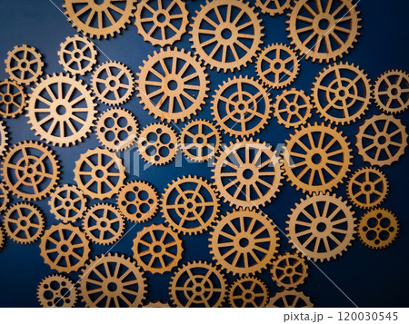 Top view wooden gear on a blue background. Top view wooden gear on a blue background. 120030545