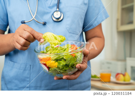 Asian Nutritionist holding healthy food for patient in hospital, nutrition and vitamin. Asian Nutritionist holding healthy food for patient in hospital, nutrition and vitamin. 120031184