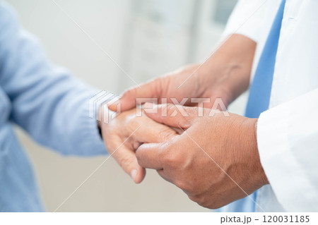 Doctor holding hands Asian elderly woman patient, help and care in hospital. 120031185