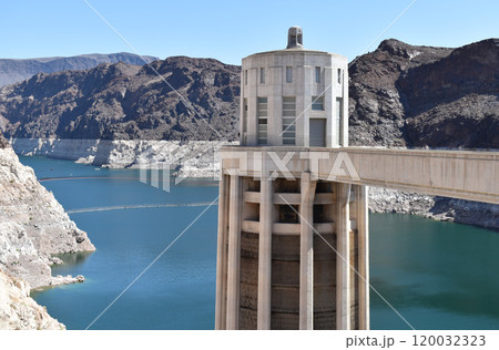 Hoover Dam, Hydroelectric power plant in Clark County, Nevada, industrial construction against the blue sky and mountains Hoover Dam, Hydroelectric power plant in Clark County, Nevada, industrial construction against the blue sky and mountains 120032323