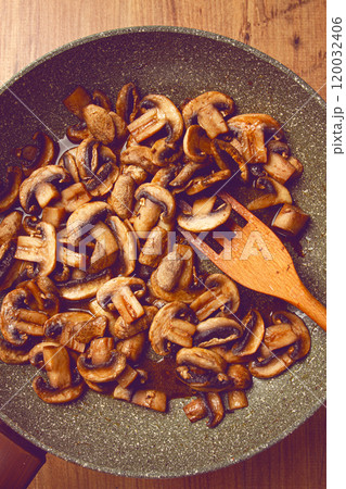 fried mushrooms in a frying pan, with a wooden fork, homemade, no people, fried mushrooms in a frying pan, with a wooden fork, homemade, no people, 120032406