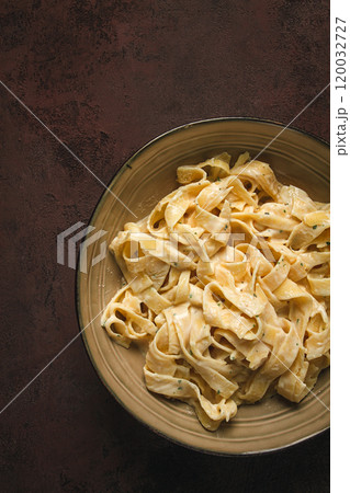 Fettuccine, tagliatelle, in creamy garlic sauce, Italian traditional cuisine, pasta carbonaro, 120032727