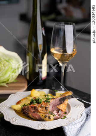 Roasted Duck Leg with Herbs and White Wine Gourmet Dining Experience. Succulent roasted duck leg 120034998
