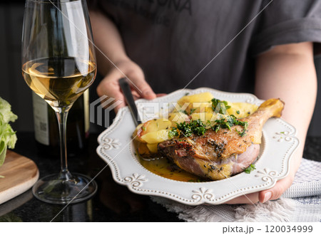 Roasted Duck Leg with Herbs and White Wine Gourmet Dining Experience. Succulent roasted duck leg Roasted Duck Leg with Herbs and White Wine Gourmet Dining Experience. Succulent roasted duck leg 120034999