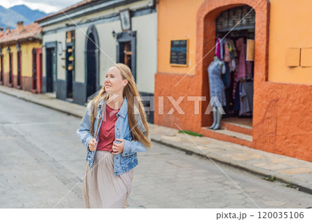 Female tourist walks through the colonial streets San Cristobal de las Casas, Mexico. Cultural exploration, architecture, and travel experience concept Female tourist walks through the colonial streets San Cristobal de las Casas, Mexico. Cultural exploration, architecture, and travel experience concept 120035106