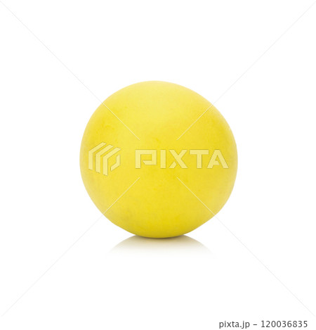 plasticine clay single yellow ball on white background closeup plasticine clay single yellow ball on white background closeup 120036835