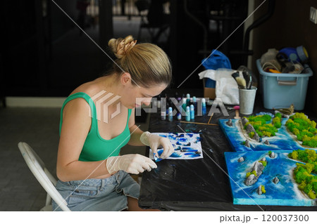 The process of making the art decor of epoxy resin, natural stones and moss The process of making the art decor of epoxy resin, natural stones and moss 120037300