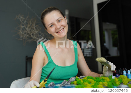 The process of making the art decor of epoxy resin, natural stones and moss 120037446