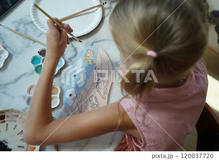 A young mother and her daughter enjoy a creative art session at home A young mother and her daughter enjoy a creative art session at home 120037720