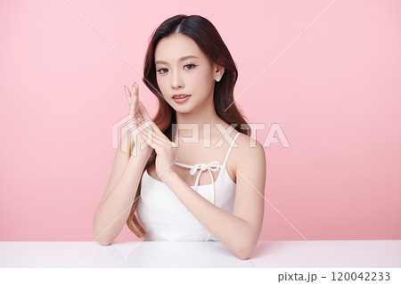 Beautiful young asian woman with clean fresh skin on pink background, Face care, Facial treatment, Cosmetology, beauty and spa, Asian women portrait. Beautiful young asian woman with clean fresh skin on pink background, Face care, Facial treatment, Cosmetology, beauty and spa, Asian women portrait. 120042233