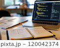 Explore effective note-taking strategies with an open notebook and laptop setup 120042374