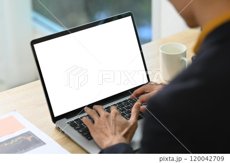 Close up of businessman hands typing on laptop keyboard Close up of businessman hands typing on laptop keyboard 120042709