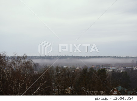 White fog spreads across the valley. White fog spreads across the valley. 120043354