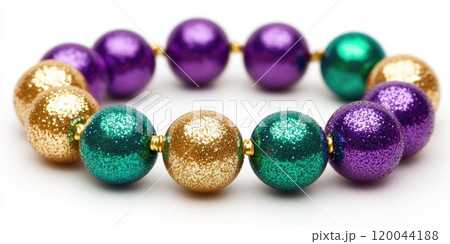 Colorful beaded circular arrangement featuring green purple gold beads for festive decoration Colorful beaded circular arrangement featuring green purple gold beads for festive decoration 120044188
