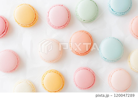Colorful and various flavors of macarons with copy space on a solid background. 120047289
