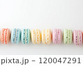 Colorful and various flavors of macarons with copy space on a solid background. 120047291