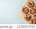 Top view of chocolate chip cookies on a solid background. 120047292