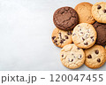 Top view of chocolate chip cookies on a solid background. 120047455