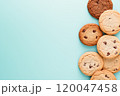 Top view of chocolate chip cookies on a solid background. 120047458