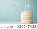 A pastel birthday cake with a light blue background and copy space. 120047482