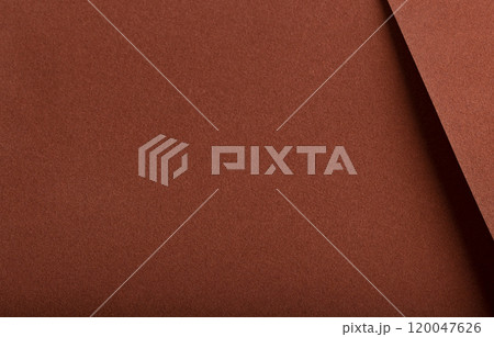 Designer paper background with a velvety, matte texture in warm, earthy hues like terracotta, ochre, 120047626