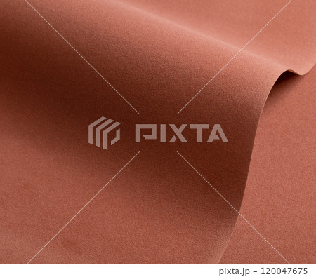 Designer paper background with a warm, velvety texture in rich earthy tones, blending shades of 120047675