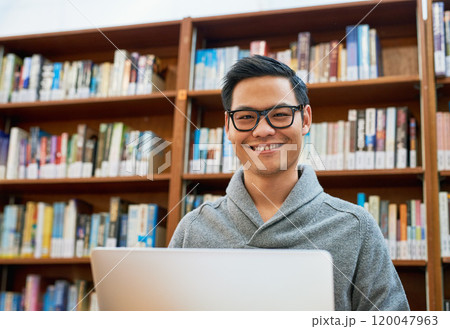 Laptop, portrait and Asian man in library for study with university, education and college scholarship. Books, online research and happy student on campus with learning, knowledge and growth in Japan Laptop, portrait and Asian man in library for study with university, education and college scholarship. Books, online research and happy student on campus with learning, knowledge and growth in Japan 120047963