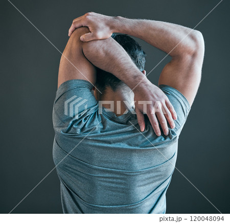 Stretching arms, fitness and back of man for exercise, training and warm up for workout on gray background. Health, sports and person with strength for wellness, performance and flexibility in gym 120048094