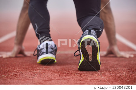 Man, shoes and running start in stadium for race, marathon and training for sport and fitness. Back, wellness and workout of athlete with cardio in arena with runner, exercise and feet before sprint 120048201