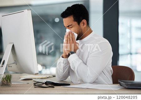 Sick, business man and blowing nose from illness and disease at work from burnout at desk. Office, computer and employee with tissue email and allergy problem at advertising agency with flu virus Sick, business man and blowing nose from illness and disease at work from burnout at desk. Office, computer and employee with tissue email and allergy problem at advertising agency with flu virus 120048205