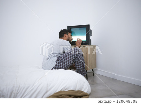 Mental health, hospital and man in asylum, watching tv or brainwashed with depression. Television, patient and person with schizophrenia, bipolar disorder or sick in psychiatric clinic for psychology 120048508