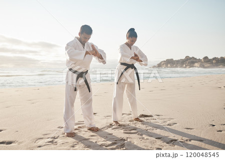 Beach, karate and couple with training, bow and fitness with martial arts, uniform and practice. Motivation, outdoor and ocean with man, wellness and respect with exercise, honor and balance 120048545