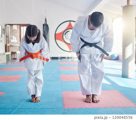 Child, teacher or bow in dojo for martial arts, training or exercise to prepare for karate education. Respect, warrior or judo master with girl kid in studio ready for taekwondo practice or workout Child, teacher or bow in dojo for martial arts, training or exercise to prepare for karate education. Respect, warrior or judo master with girl kid in studio ready for taekwondo practice or workout 120048556