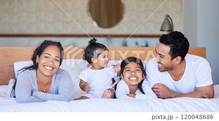 Family, kids and portrait smile on bed with healthy relationship, security and bonding in home. Mother, father and happy children on mattress with love support, relax together and wake up in morning Family, kids and portrait smile on bed with healthy relationship, security and bonding in home. Mother, father and happy children on mattress with love support, relax together and wake up in morning 120048686
