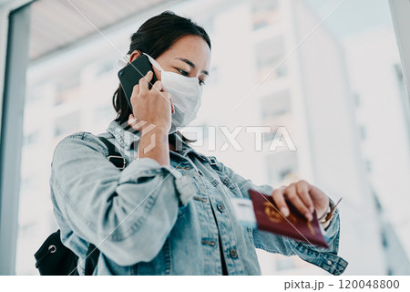 Woman, phone call and covid face mask in building, time management and passport book in airport. Online, communication and speaking with virtual contact for flight, listening and travel information Woman, phone call and covid face mask in building, time management and passport book in airport. Online, communication and speaking with virtual contact for flight, listening and travel information 120048800