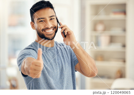 Portrait, phone call and man with thumbs up in living room for communication, success or agreement. Contact, smile and person with hand gesture for achievement, conversation or loan approval in home Portrait, phone call and man with thumbs up in living room for communication, success or agreement. Contact, smile and person with hand gesture for achievement, conversation or loan approval in home 120049065