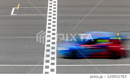 Motion blur race car racing on speed track, Car race on the international circuit race track crossing start and finish line, Race car crossing start and finish line, Target business achieve. Motion blur race car racing on speed track, Car race on the international circuit race track crossing start and finish line, Race car crossing start and finish line, Target business achieve. 120052763